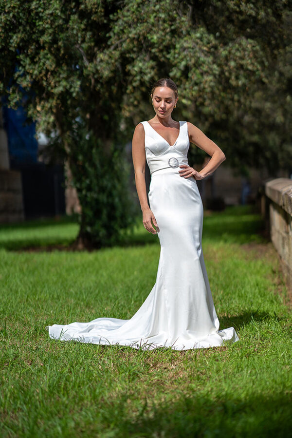 Woman posing in the stunning Laila wedding gown by Roya Javaheri