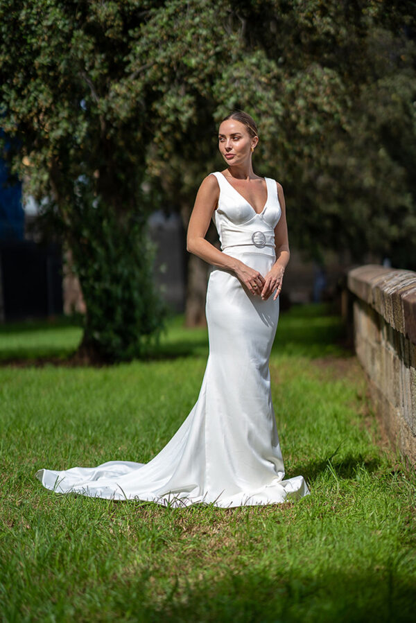 Woman posing in the stunning Laila wedding gown by Roya Javaheri