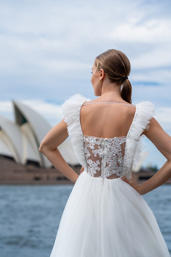 Woman wearing a stunning Roya Javaheri wedding dress