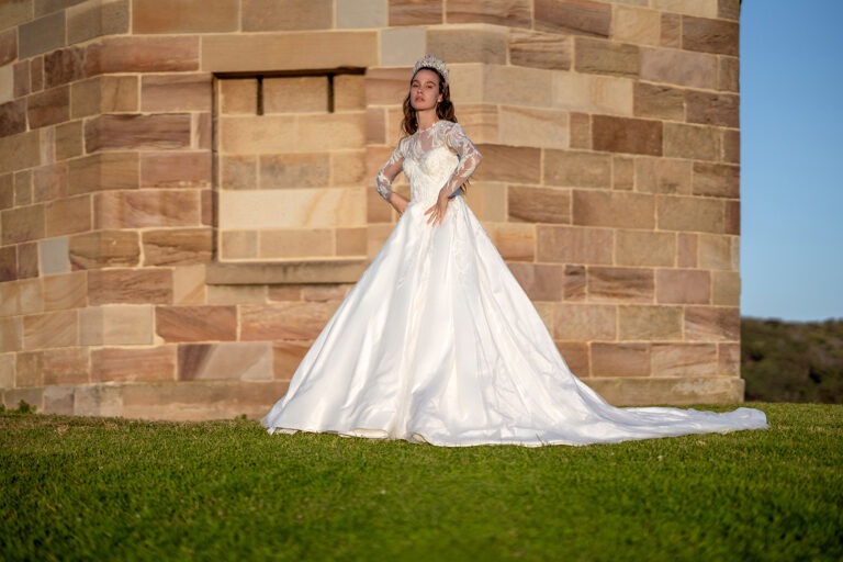 Woman wearing a stunning Roya Javaheri wedding dress and crown