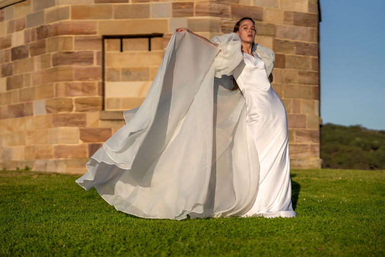 Woman wearing a stunning Roya Javaheri wedding gown with Angel detachable sleeves