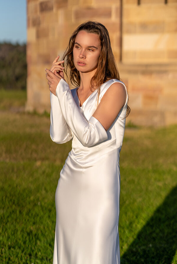 Woman wearing a stunning Roya Javaheri wedding gown with detachable sleeves