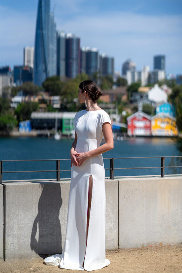 Woman posing in the stunning Lindy wedding dress by Roya Javaheri