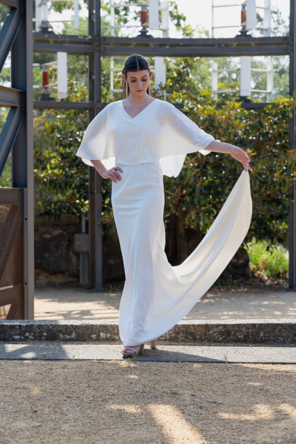 Woman posing in the stunning Enya wedding dress by Roya Javaheri