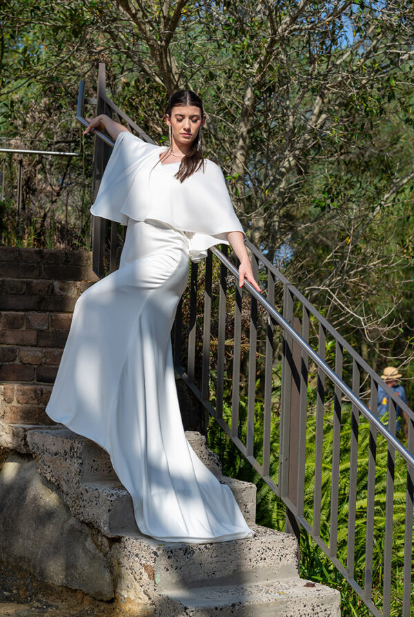 Woman posing in the stunning Enya wedding dress by Roya Javaheri