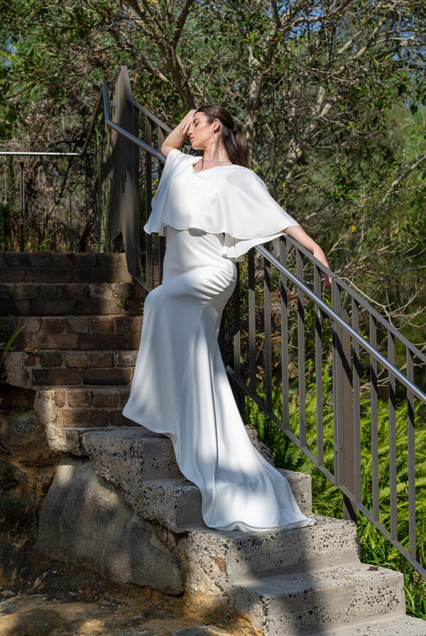 Woman posing in the stunning Enya wedding dress by Roya Javaheri