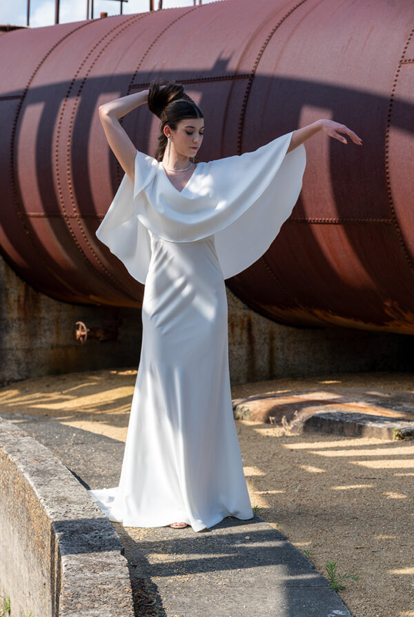 Woman posing in the stunning Enya wedding dress by Roya Javaheri